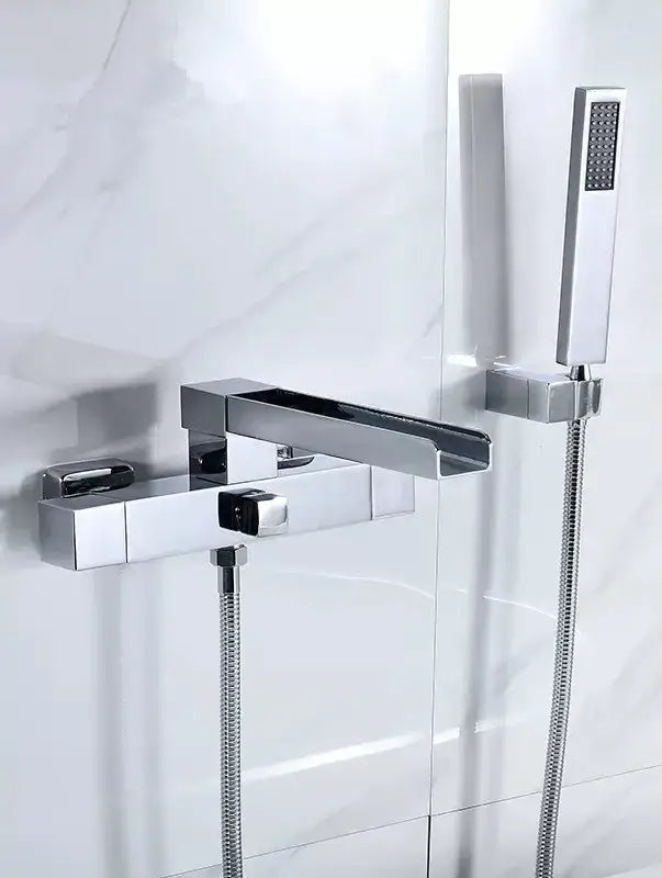 Modern brushed gold wall mounted waterfall bathtub set with matching chrome chrome finished faucet and handheld showerhead