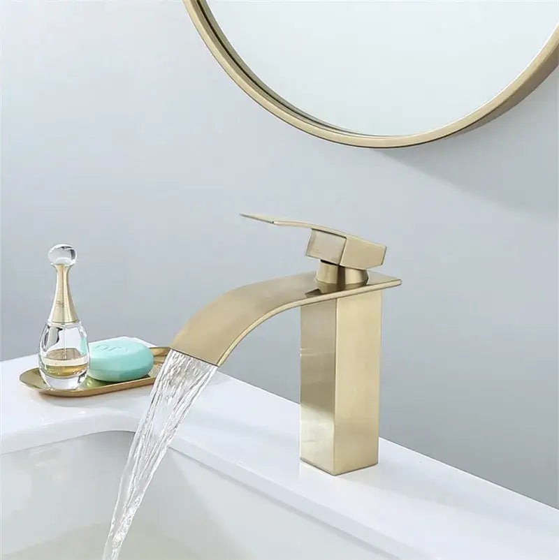 Modern brushed gold basin faucet with sleek angular waterfall design and decorbites brushed gold metal finish