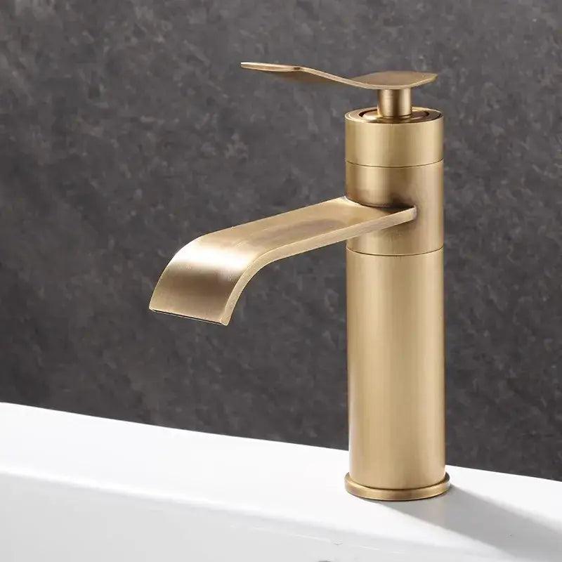 Modern brushed gold waterfall basin mixer with brass finish and curved spout for decorbites bronze bathroom sink use
