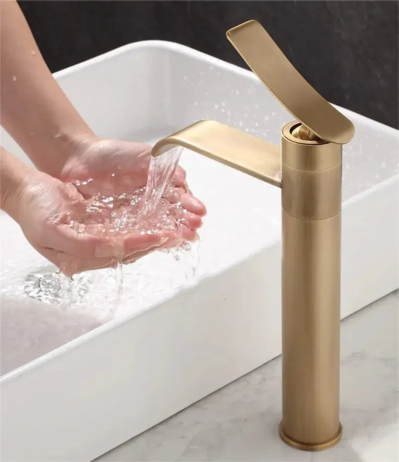 Modern brushed gold basin mixer with a sleek tall cylindrical body for decorbites bronze bathroom sink use