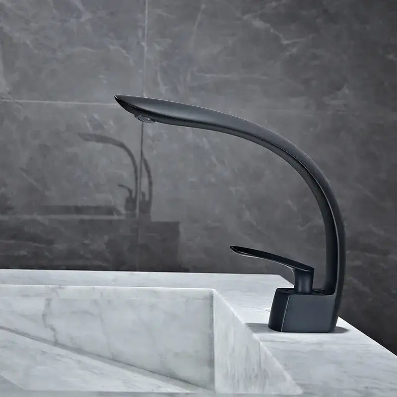 Modern black matte basin mixer tap with sleek curved spout and minimalist design for bathroom use