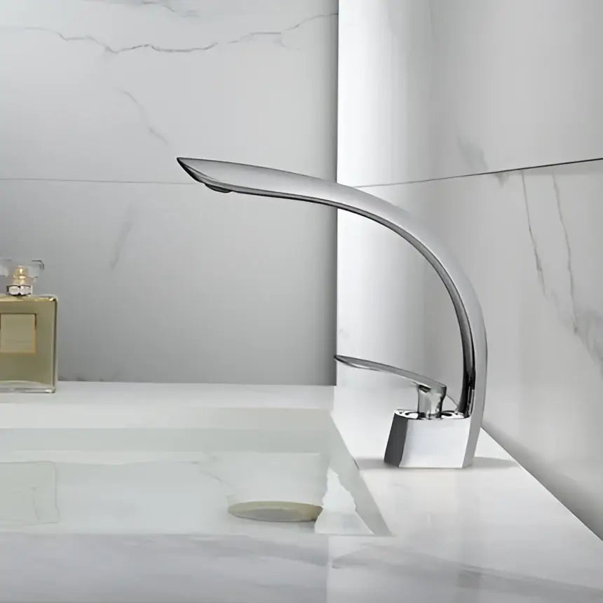 Modern chrome basin mixer tap with sleek curved spout and square base for stylish bathroom basin mixer use