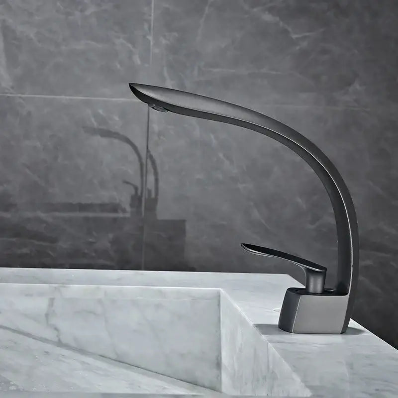 Modern matte black basin mixer tap with sleek curved design and minimalist aesthetic for bathroom use