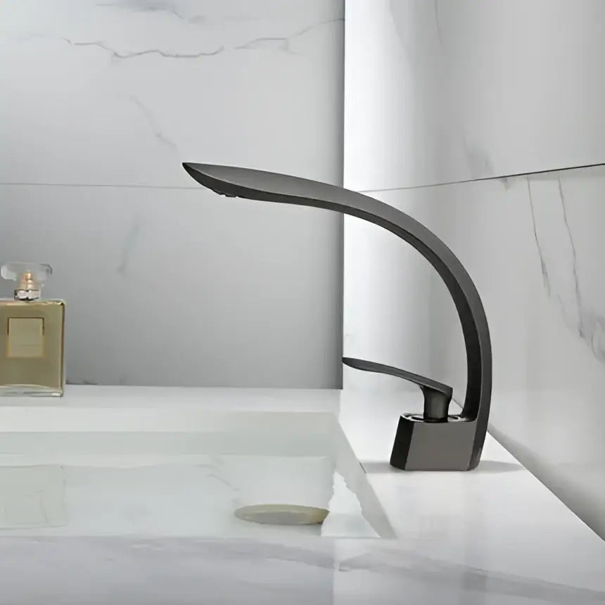 Modern matte black basin mixer tap with sleek curved design and minimalist aesthetic for bathroom use
