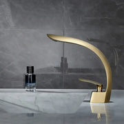 Modern brushed gold waterfall basin mixer tap with sleek curved design for bathroom basin mixer use