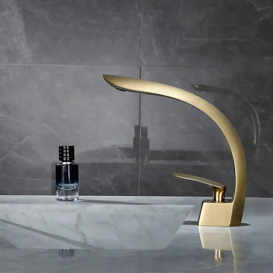 Modern brushed gold waterfall basin mixer tap with sleek curved design for bathroom basin mixer use