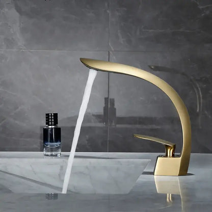 Modern brushed gold waterfall basin mixer tap with sleek curved design for stylish bathroom sink use