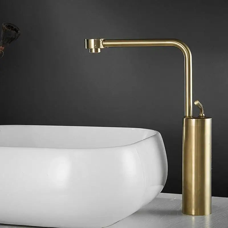 Modern brushed gold waterfall faucet swivel sink with brass finish cylindrical base and curved spout decorbites brushed gold