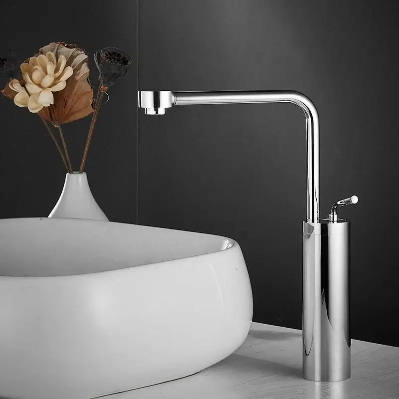 Modern chrome-finished waterfall faucet with sleek cylindrical base and curved spout for faucet swivel sink use