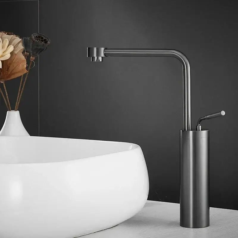 Modern brushed gold faucet swivel sink with a sleek matte black cylindrical base and curved spout by decorbites