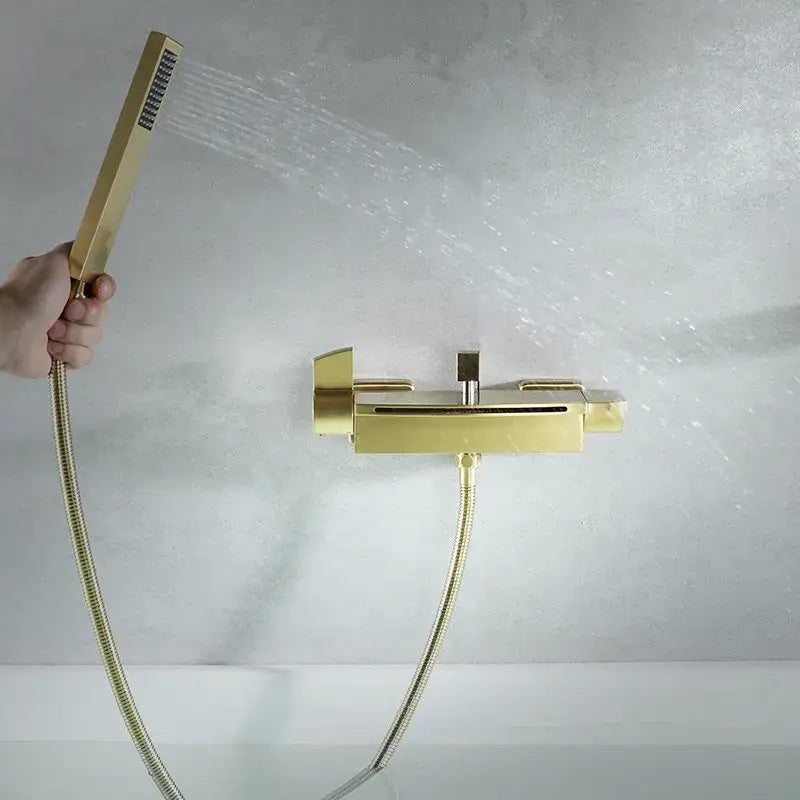 Modern brushed gold waterfall shower faucet set featuring a gold-colored rectangular handheld shower faucet with flexible hoses
