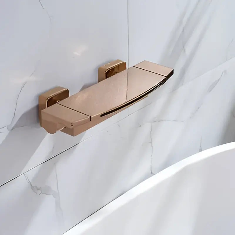 Rose gold bathroom soap dish with sleek modern design and brushed metal finish complementing shower faucet set