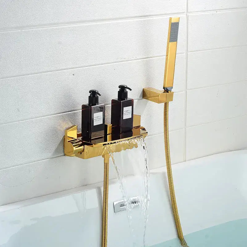 Modern brushed gold waterfall shower faucet set with integrated showerhead and built-in shelf holding pump bottles