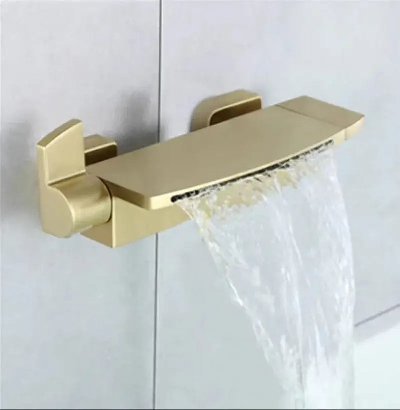 Modern brushed gold waterfall shower faucet set with sleek rectangular spout and gold-toned finish for bathroom use