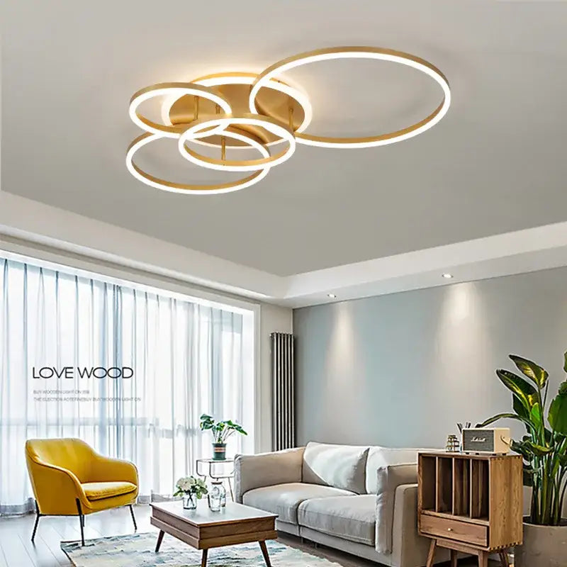 Modern brushed golden led ceiling chandelier with overlapping rings and warm ambient glow for living room decorbites brushed golden