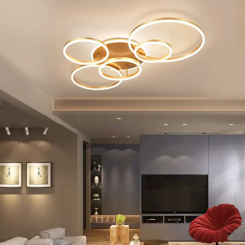 Modern brushed golden led ceiling chandelier with interconnected rings in brushed golden led finish for living room decorbites