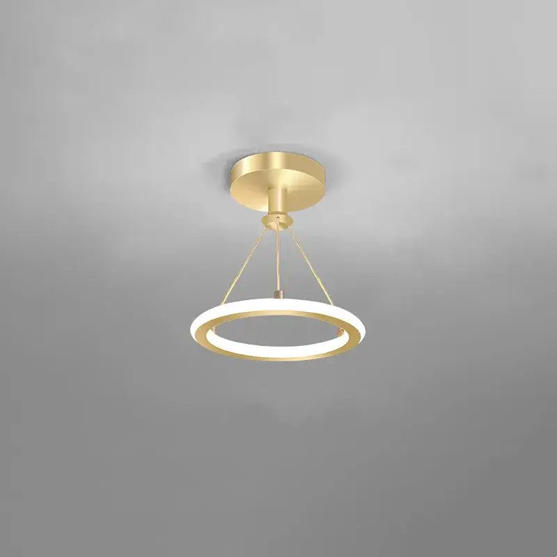 Modern brushed golden led ceiling chandelier with sleek circular rings and illuminated inner band for living room decorbites brushed golden