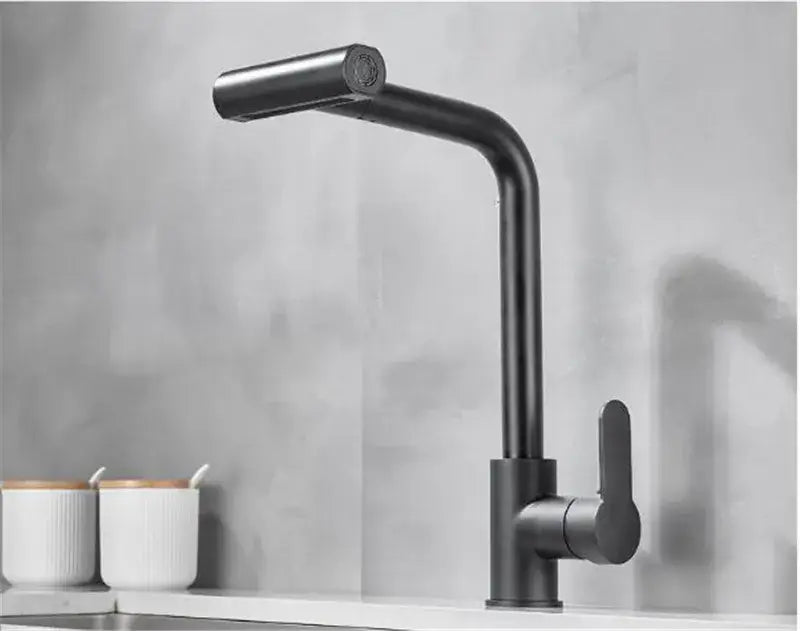 Modern matte black kitchen faucet with sleek curved spout complements gray waterfall kitchen faucet with pull out spray design
