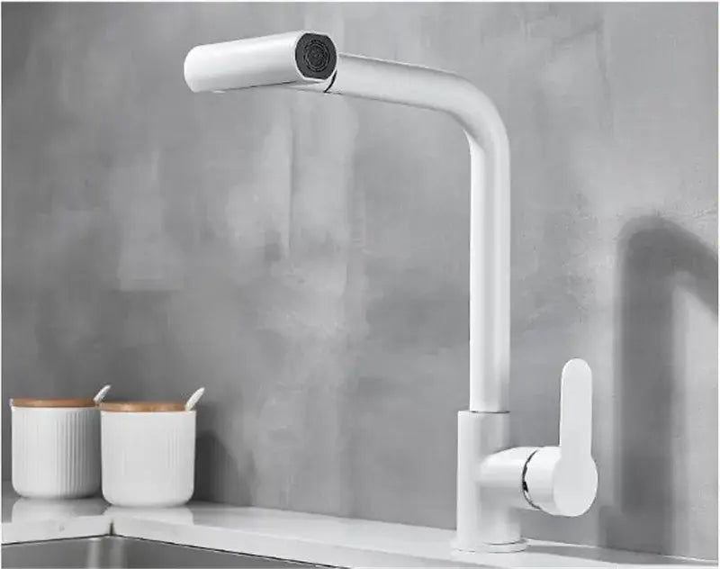Modern brushed gray waterfall kitchen faucet with a sleek curved spout and pull out spray in minimalist design