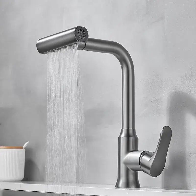 Modern brushed gray waterfall kitchen faucet with sleek curved spout and pull-down spray head in stainless steel