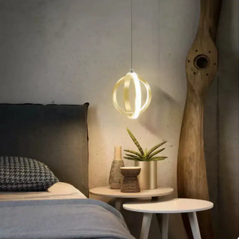 Modern brushed metal and white acrylic decorbites led bedside pendant light with glowing circular minimalist design