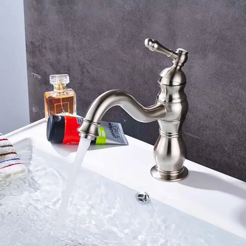Modern brushed nickel basin faucet with single handle, long curved spout, and decorative handle for bathroom mixer
