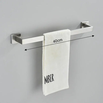 Modern brushed nickel bathroom hardware set featuring a silver stainless steel towel rack with a sleek design