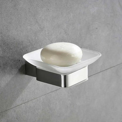 Modern frosted glass soap dish with stainless steel base holding white soap from bathroom hardware set