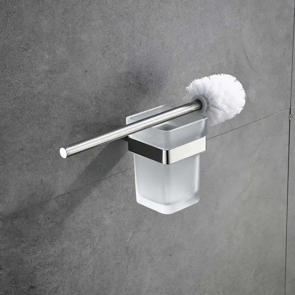 Modern brushed nickel bathroom hardware set featuring a stainless steel and frosted glass toilet brush holder with white bristles