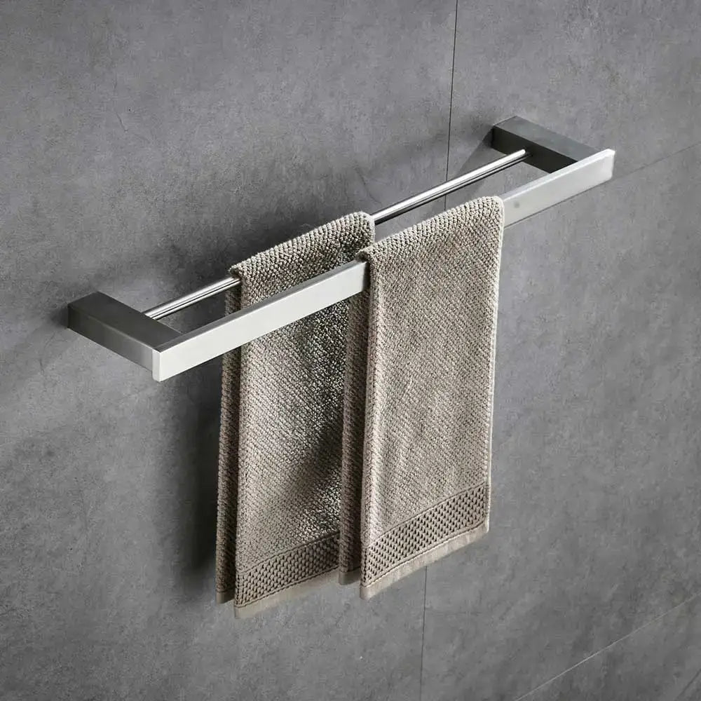 Modern brushed nickel bathroom hardware set featuring a stainless steel double towel rack with beige towels