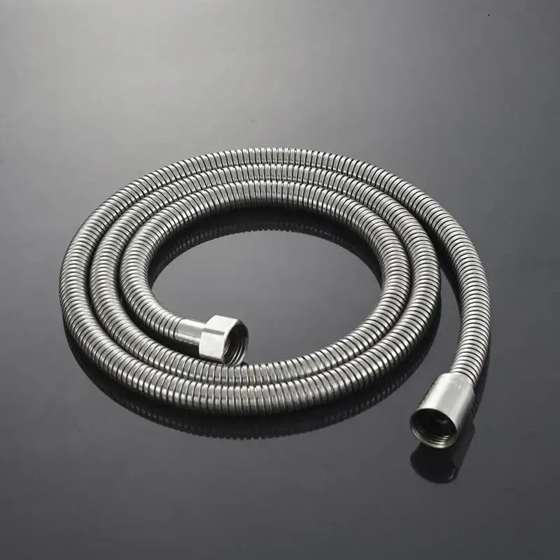 A coiled flexible shower hose with a ribbed texture in brushed nickel for decorbites handshower set