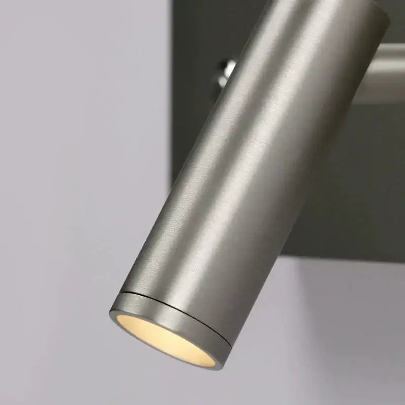 Modern brushed nickel led dimmable reading wall light with a cylindrical stainless steel design and warm diffused light output