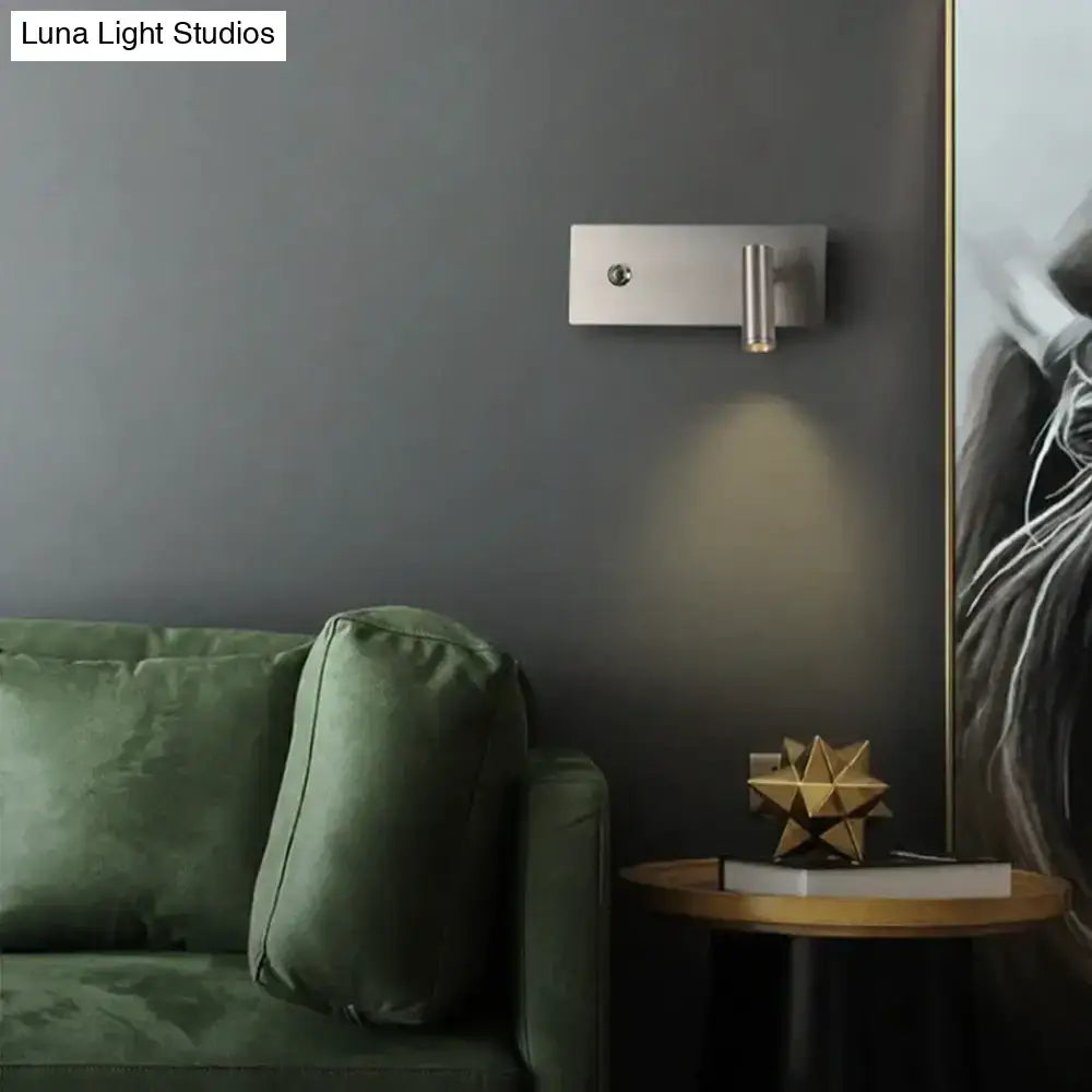 Modern brushed nickel led dimmable reading wall light with a sleek rectangular base and cylindrical light head for bedroom use