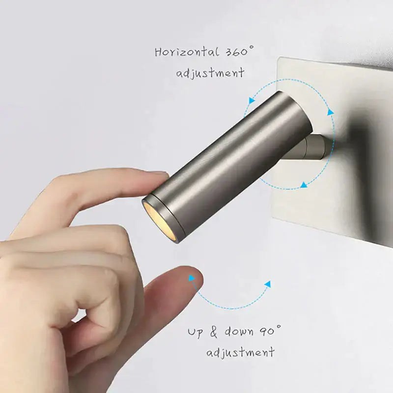 A sleek brushed nickel led dimmable reading wall light with a warm bulb for bedroom use in stainless steel finish