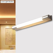 Modern brushed nickel wall light with rectangular design and frosted glass diffuser providing warm white light