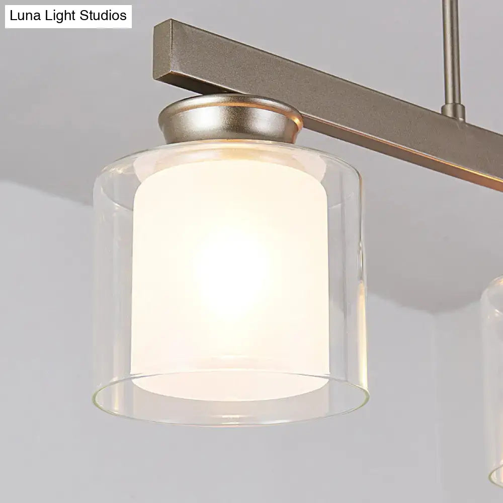 Decorbites traditional gold island hanging lamp with clear glass shade and frosted interior on brushed metal arm