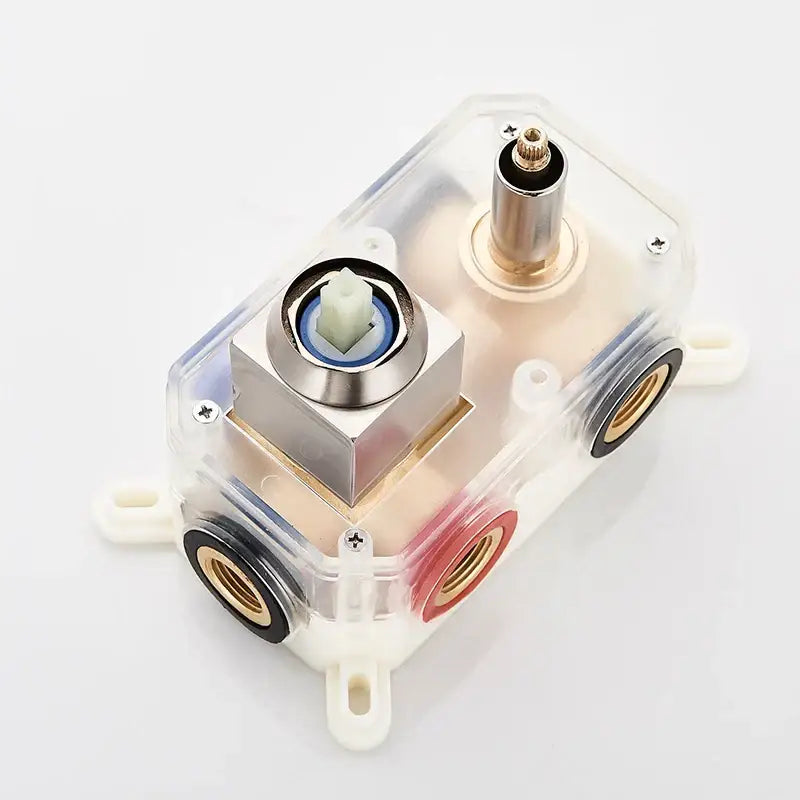 Clear plastic housing with silver valve and brass fittings in modern brushed nickel shower faucet set with tub spout