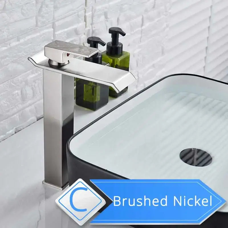 Modern brushed nickel single lever basin faucet with tall column base and sleek rectangular waterfall spout for bathroom use