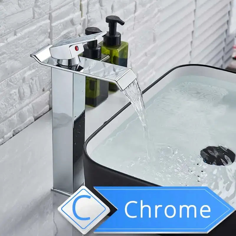 Modern brushed nickel single lever basin faucet with chrome-finished waterfall spout and sleek modern design