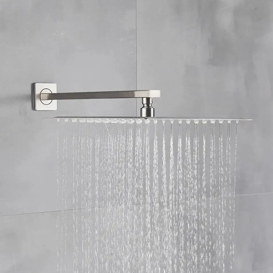 Modern brushed nickel square rainfall shower head with sleek rectangular design and multiple even water streams