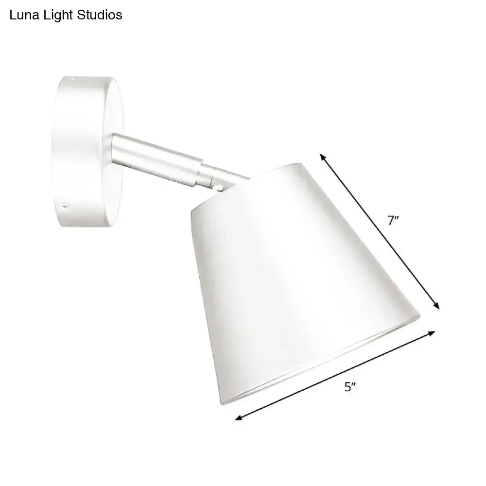 Modern brushed nickel tapered wall sconce with white conical spotlight and sleek metallic arm wall light sconce
