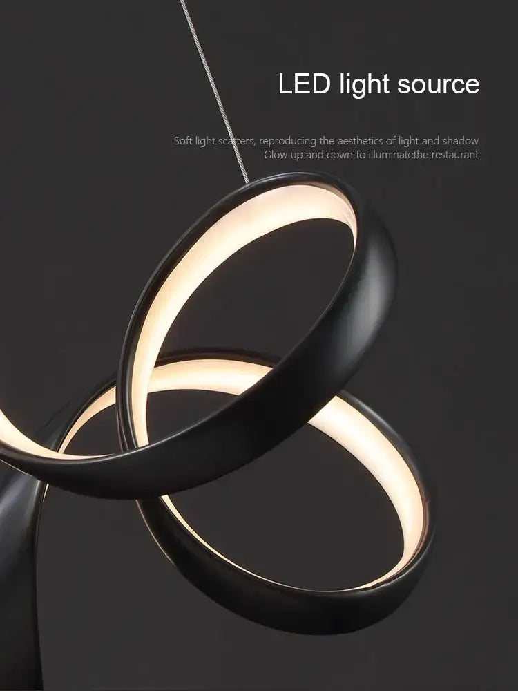 Modern brushed silver creative twisted led chandelier with black minimalist interlocking rings and warm glow for living room decorbites creative twisted