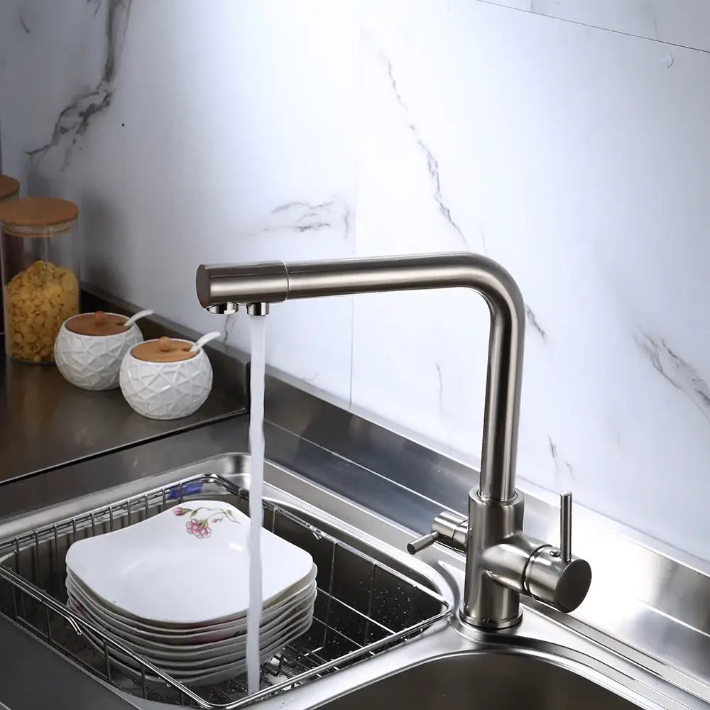 Modern brushed stainless steel dual handle kitchen filter faucet with a sleek curved spout and durable material