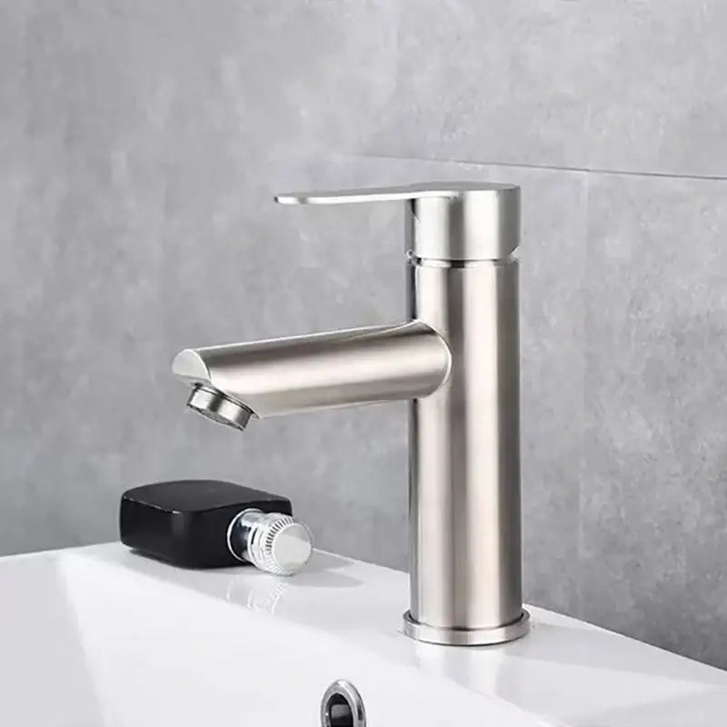 Modern brushed stainless steel single handle bathroom faucet with sleek minimalist design in brushed stainless finish