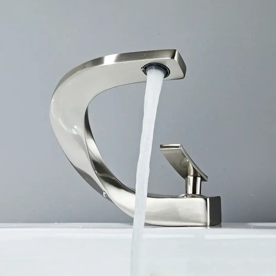 Modern brushed stainless steel waterfall basin faucet with sleek curved design and single lever handle for decorbites basin faucet
