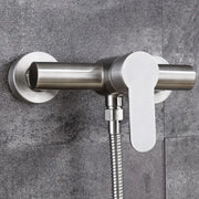 Modern brushed stainless steel and white ceramic shower mixer with flexible hose for bathroom use