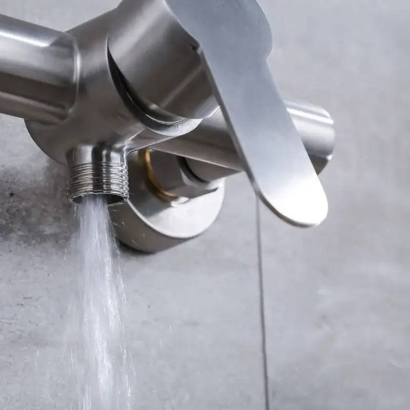 Modern brushed stainless steel bathroom faucet with sleek single lever handle for shower mixer use in white ceramic settings
