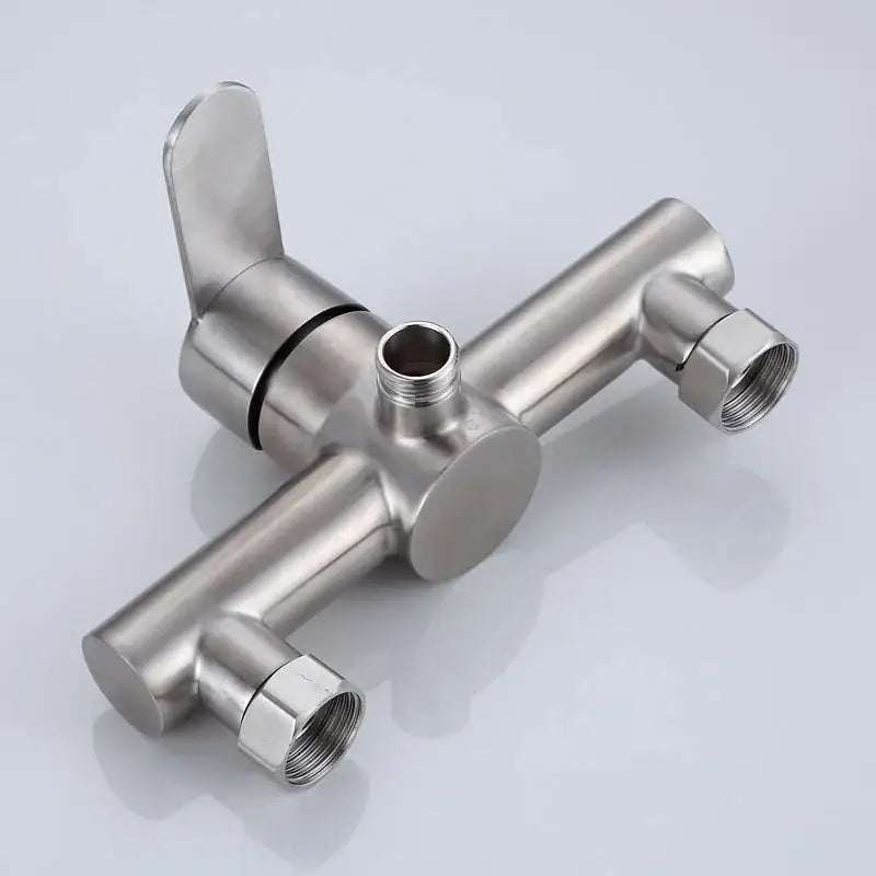 Modern brushed stainless steel shower mixer valve with white ceramic accents and three threaded outlets for bathroom use