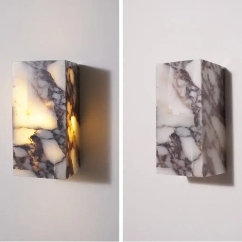 Modern bulgari stone led wall lights featuring a rectangular alabaster sconce in polished white and gray marble with warm light