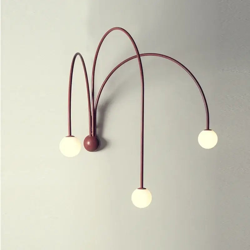 Modern burgundy iron glass led wall light with three curved metal arms and globe bulbs for living room decorbites wall light